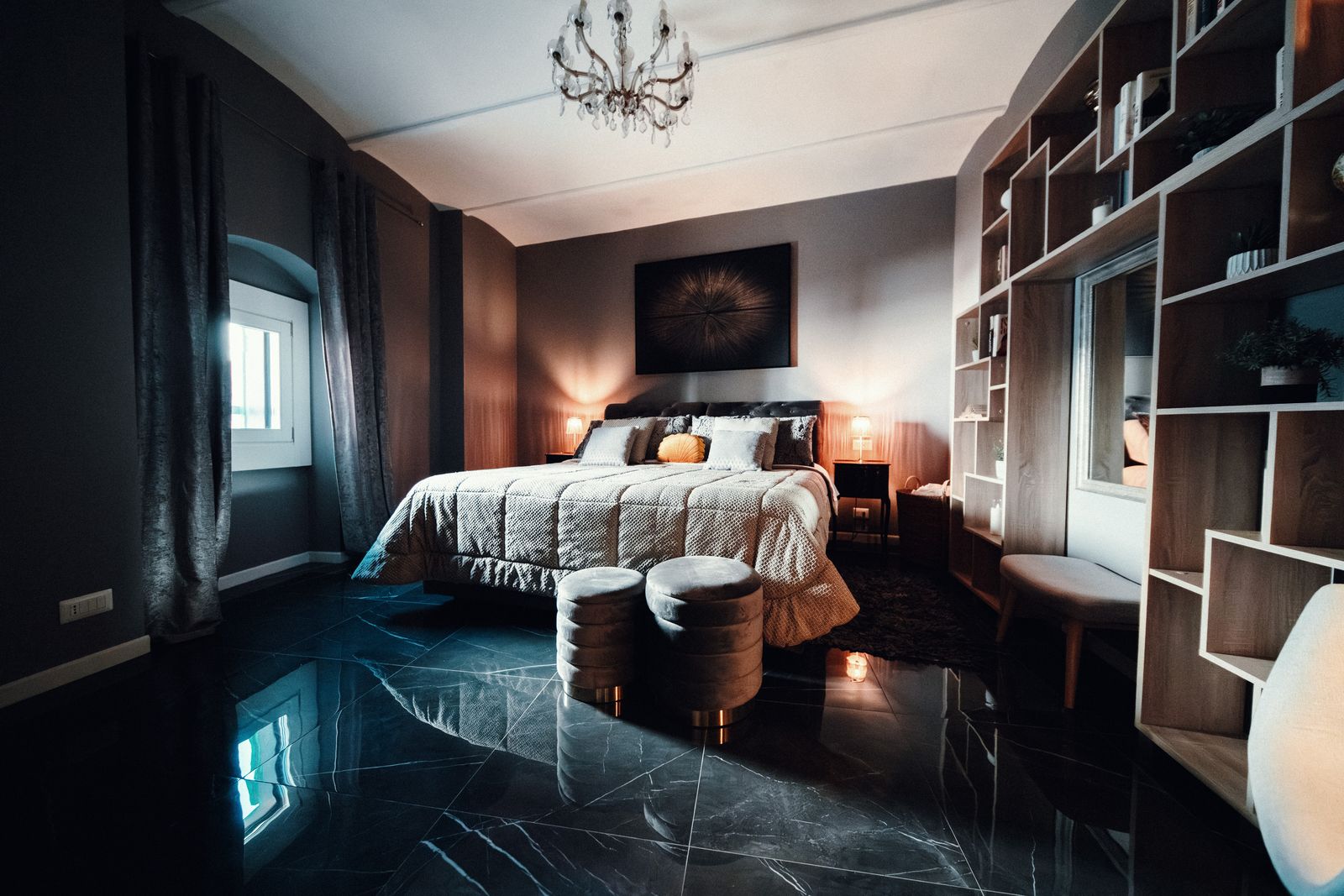 The bookshelves and the polished black floor.